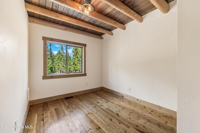 164 Generations Dr, Athol, ID 83801 - empty room featuring visible vents, baseboards, wooden ceiling, light wood-style floors, and beamed ceiling