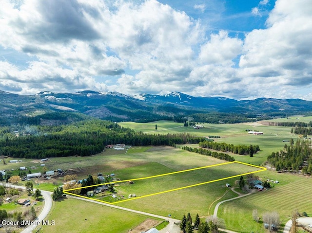 aerial view featuring a rural view and a mountain view