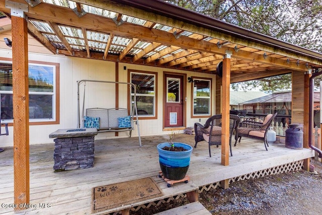wooden terrace with a pergola