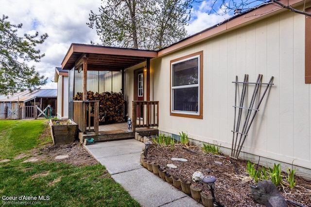 entrance to property with a yard