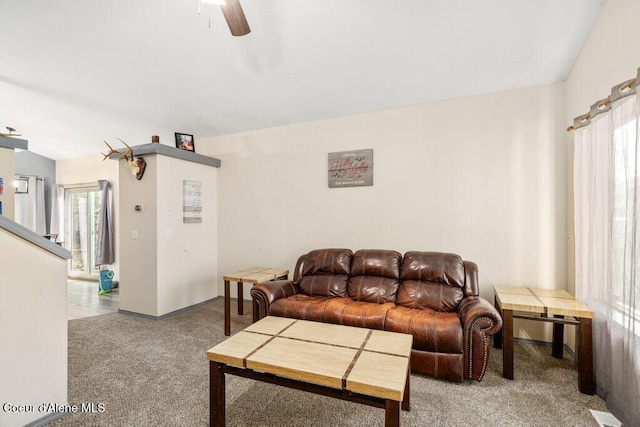 carpeted living room featuring a ceiling fan