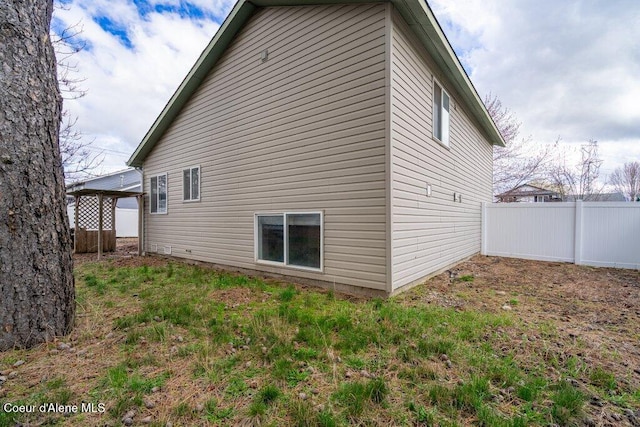 back of property with fence