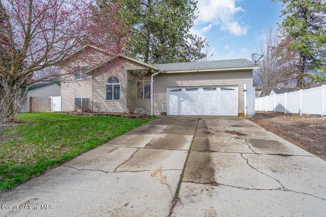 single story home featuring concrete driveway, a garage, fence, and a front lawn