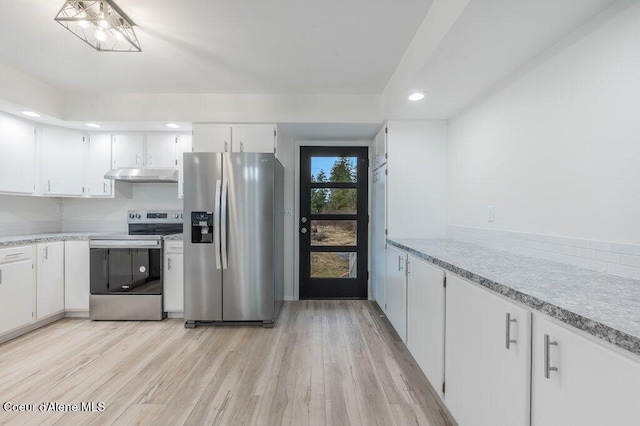 kitchen featuring white cabinetry, light countertops, appliances with stainless steel finishes, and under cabinet range hood