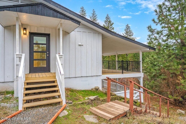 entrance to property featuring board and batten siding