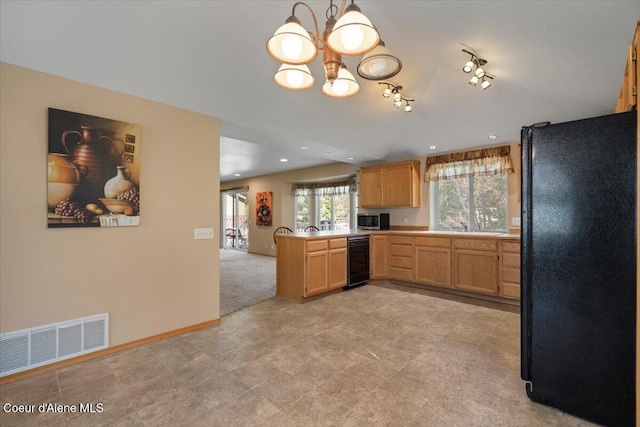 kitchen with freestanding refrigerator, visible vents, stainless steel microwave, beverage cooler, and a notable chandelier