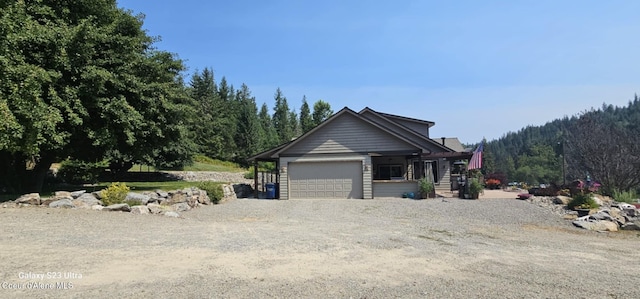 view of front of property featuring driveway and a garage