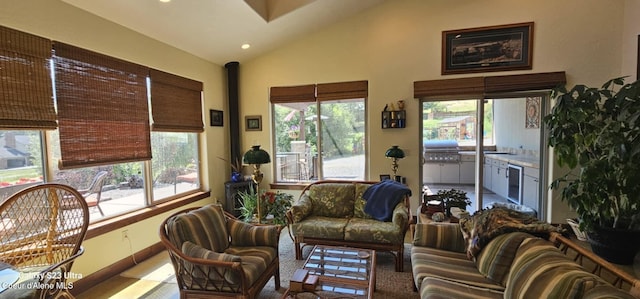 living area featuring wine cooler, high vaulted ceiling, and recessed lighting