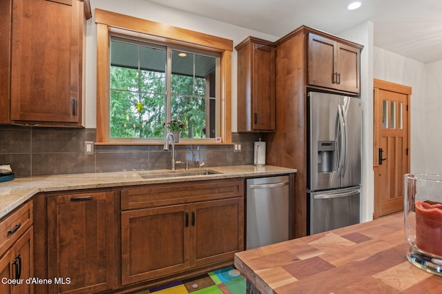137 Bitterroot Pass, Sagle, ID 83860 - kitchen with stainless steel appliances, tasteful backsplash, butcher block countertops, and a sink