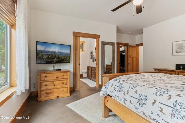 137 Bitterroot Pass, Sagle, ID 83860 - bedroom featuring ensuite bath, ceiling fan, baseboards, and carpet floors
