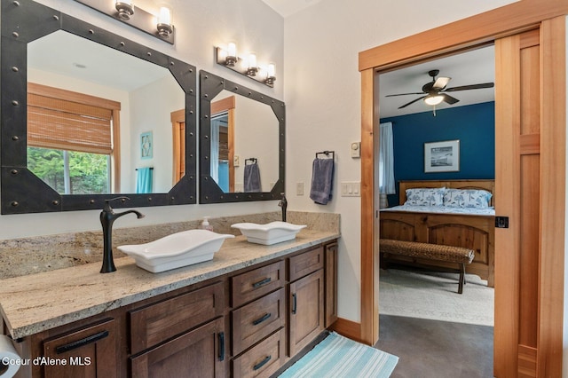 137 Bitterroot Pass, Sagle, ID 83860 - ensuite bathroom with ensuite bathroom, baseboards, a sink, ceiling fan, and double vanity