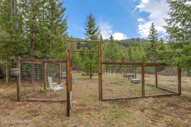 137 Bitterroot Pass, Sagle, ID 83860 - view of gate with a forest view