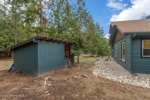 137 Bitterroot Pass, Sagle, ID 83860 - exterior space featuring roof with shingles and an outdoor structure