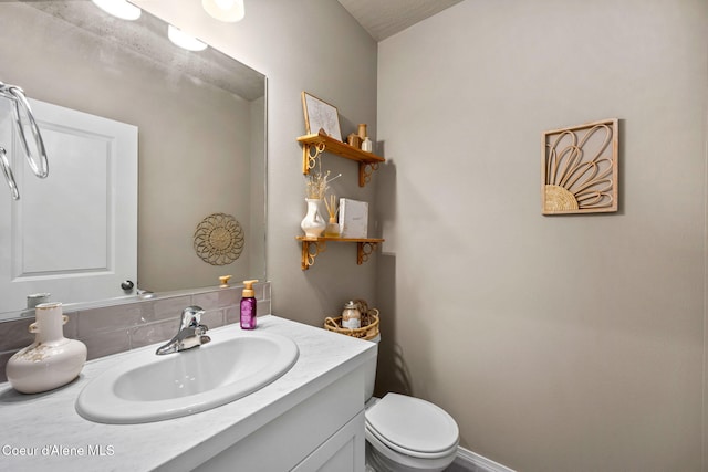 4209 May Ella Lp, Post Falls, ID 83854 - bathroom with toilet, tasteful backsplash, and vanity