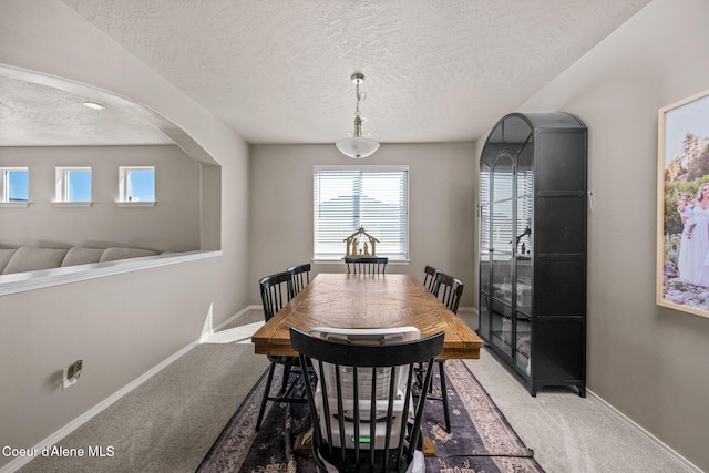4209 May Ella Lp, Post Falls, ID 83854 - carpeted dining area with a textured ceiling and baseboards
