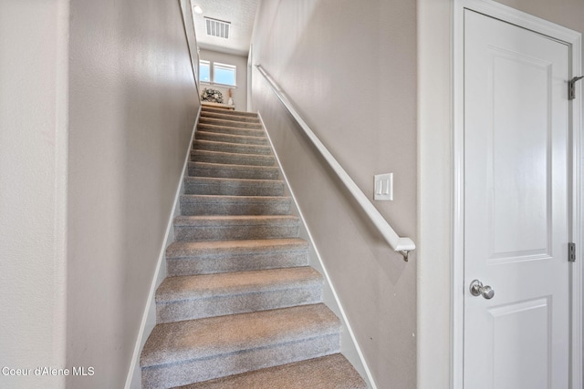 4209 May Ella Lp, Post Falls, ID 83854 - stairs featuring baseboards, carpet floors, and visible vents