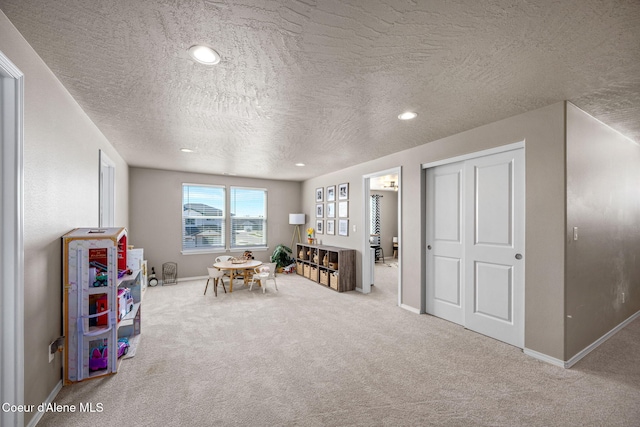 4209 May Ella Lp, Post Falls, ID 83854 - game room with carpet floors, a textured ceiling, and baseboards