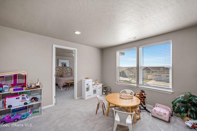 4209 May Ella Lp, Post Falls, ID 83854 - game room featuring baseboards, a textured ceiling, visible vents, and carpet