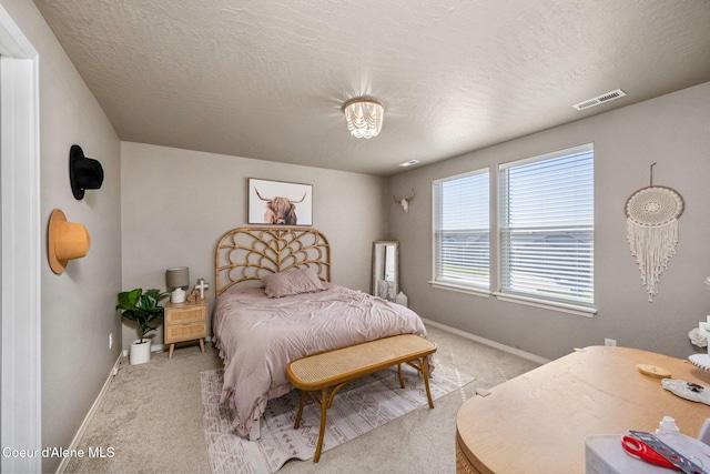 4209 May Ella Lp, Post Falls, ID 83854 - bedroom featuring visible vents, light carpet, baseboards, and a textured ceiling