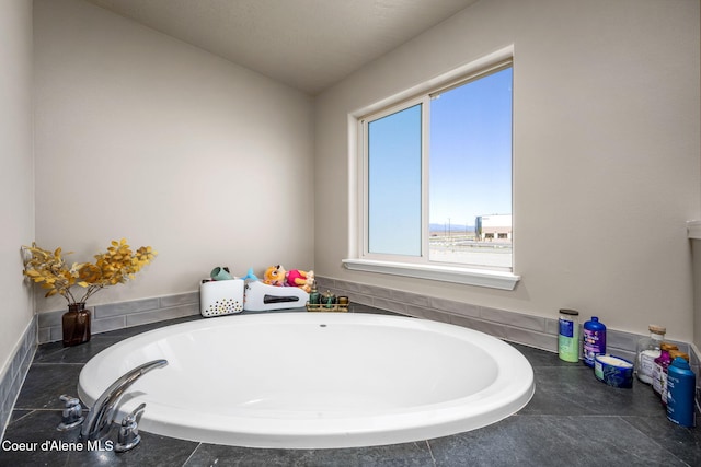 4209 May Ella Lp, Post Falls, ID 83854 - bathroom featuring a tub to relax in and vaulted ceiling