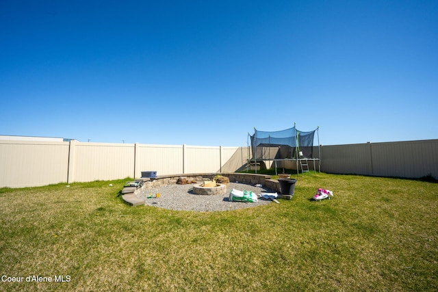 4209 May Ella Lp, Post Falls, ID 83854 - view of playground with a trampoline, a lawn, and a fenced backyard