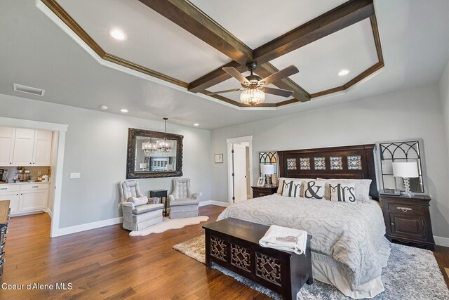 bedroom with coffered ceiling, wood finished floors, baseboards, and visible vents