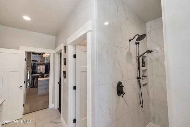 full bathroom featuring a marble finish shower, a spacious closet, recessed lighting, and marble finish floor