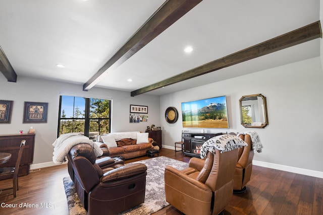 living room featuring baseboards and hardwood / wood-style floors