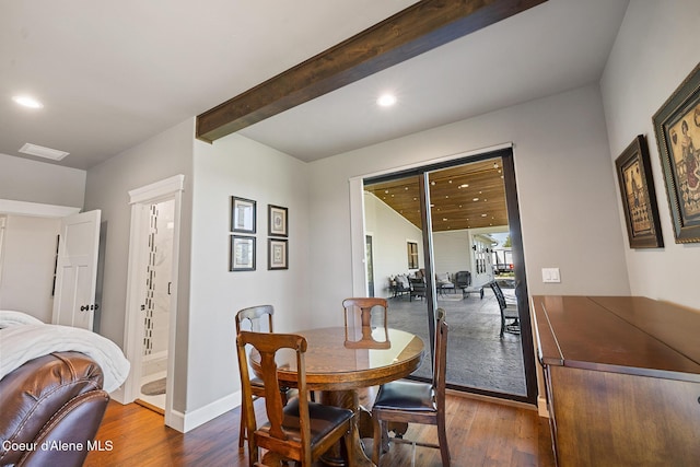 dining room with visible vents, baseboards, dark wood finished floors, beam ceiling, and recessed lighting