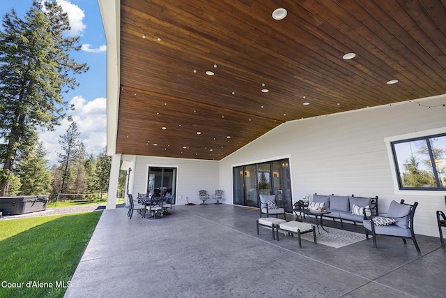 view of patio featuring an outdoor living space and a hot tub