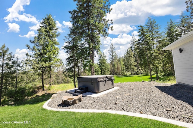 view of yard with a hot tub