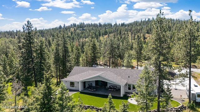 bird's eye view featuring a view of trees