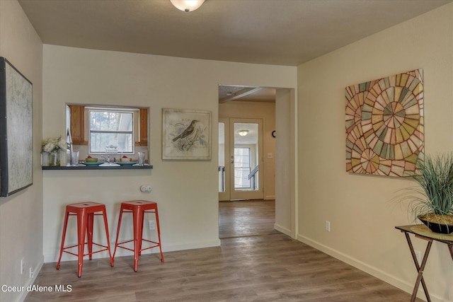 1813 N Spokane St, Post Falls, ID 83854 - interior space with plenty of natural light, baseboards, and wood finished floors