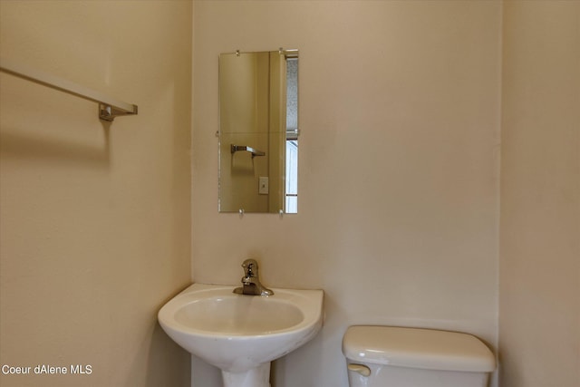 1813 N Spokane St, Post Falls, ID 83854 - half bathroom featuring toilet and a sink