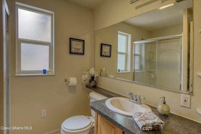 1813 N Spokane St, Post Falls, ID 83854 - full bath featuring vanity, an enclosed shower, and toilet