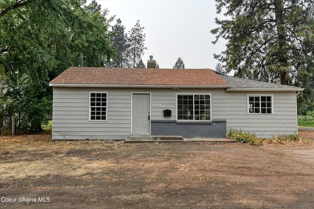 1813 N Spokane St, Post Falls, ID 83854 - back of property featuring a chimney