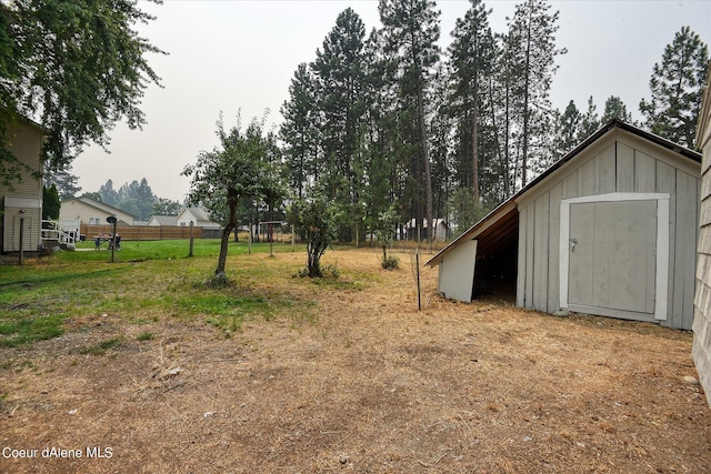 1813 N Spokane St, Post Falls, ID 83854 - view of yard with fence, an outdoor structure, and a shed