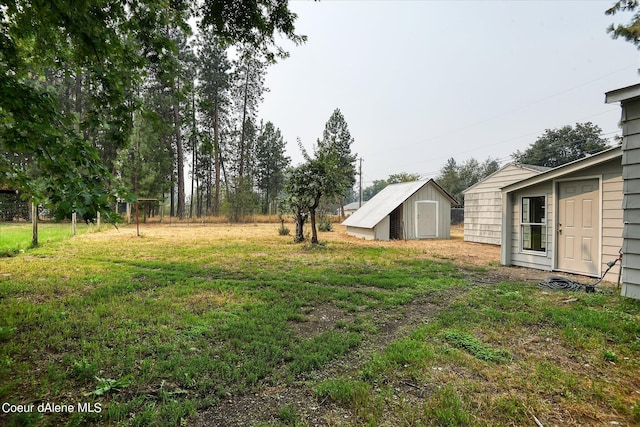 1813 N Spokane St, Post Falls, ID 83854 - view of yard with a storage shed and an outdoor structure