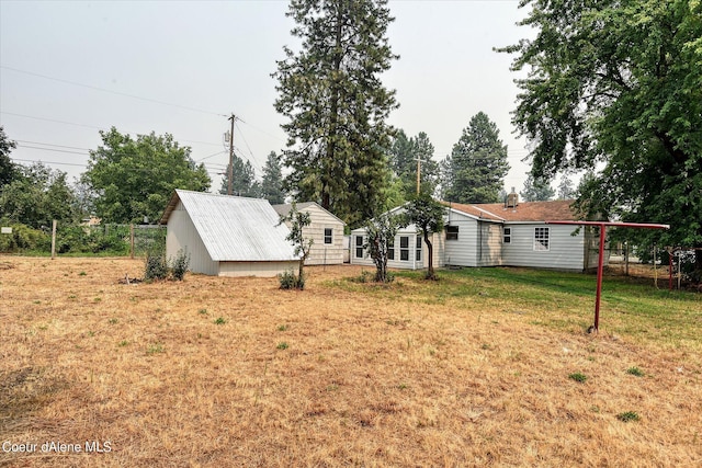 1813 N Spokane St, Post Falls, ID 83854 - back of house with a yard and fence