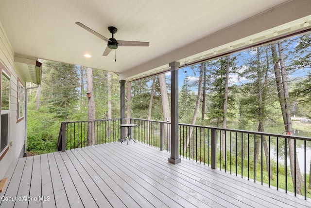 26 Hanaford Rd, Blanchard, ID 83804 - wooden deck featuring a ceiling fan and view of wooded area