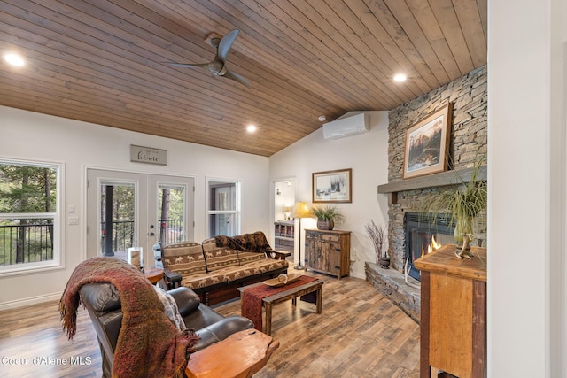 26 Hanaford Rd, Blanchard, ID 83804 - living room featuring wooden ceiling, a wall mounted air conditioner, vaulted ceiling, a stone fireplace, and french doors