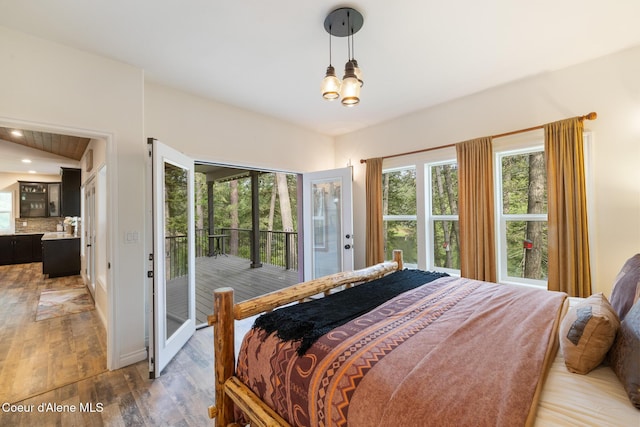 26 Hanaford Rd, Blanchard, ID 83804 - bedroom featuring access to outside, light wood finished floors, and a chandelier