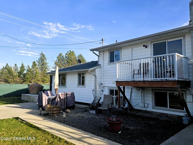 rear view of house with a balcony