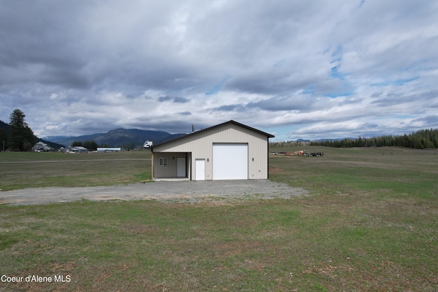 detached garage featuring a mountain view