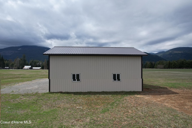 view of outbuilding featuring an outdoor structure and a mountain view