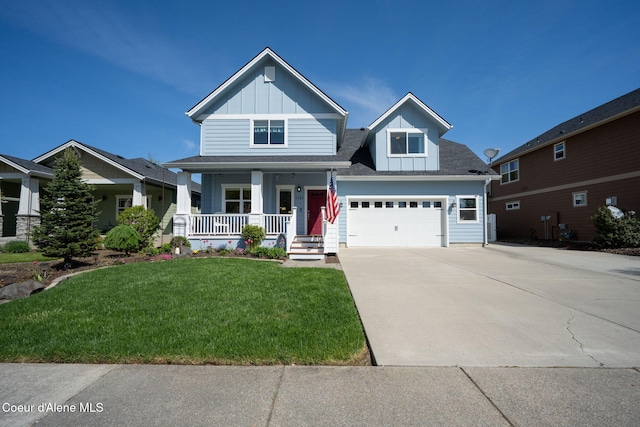 craftsman inspired home with a porch, board and batten siding, a front yard, a garage, and concrete driveway