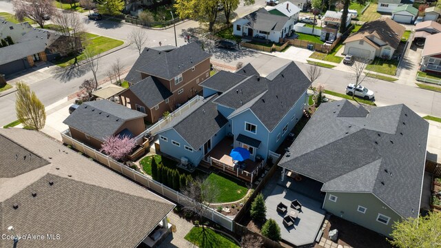 birds eye view of property with a residential view