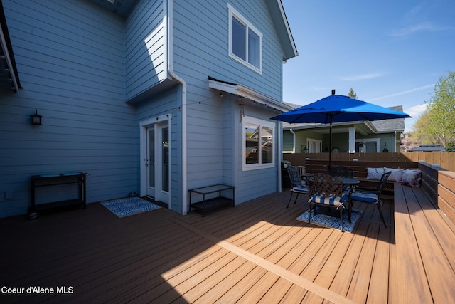 wooden deck featuring fence and outdoor dining area