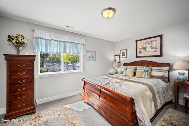 bedroom featuring carpet floors, baseboards, and visible vents