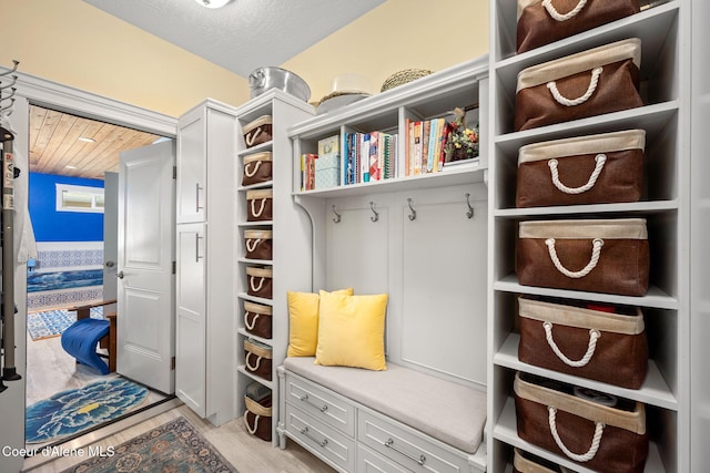 mudroom with light wood finished floors